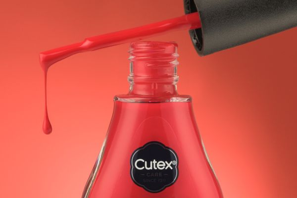 A bottle of red nail varnish